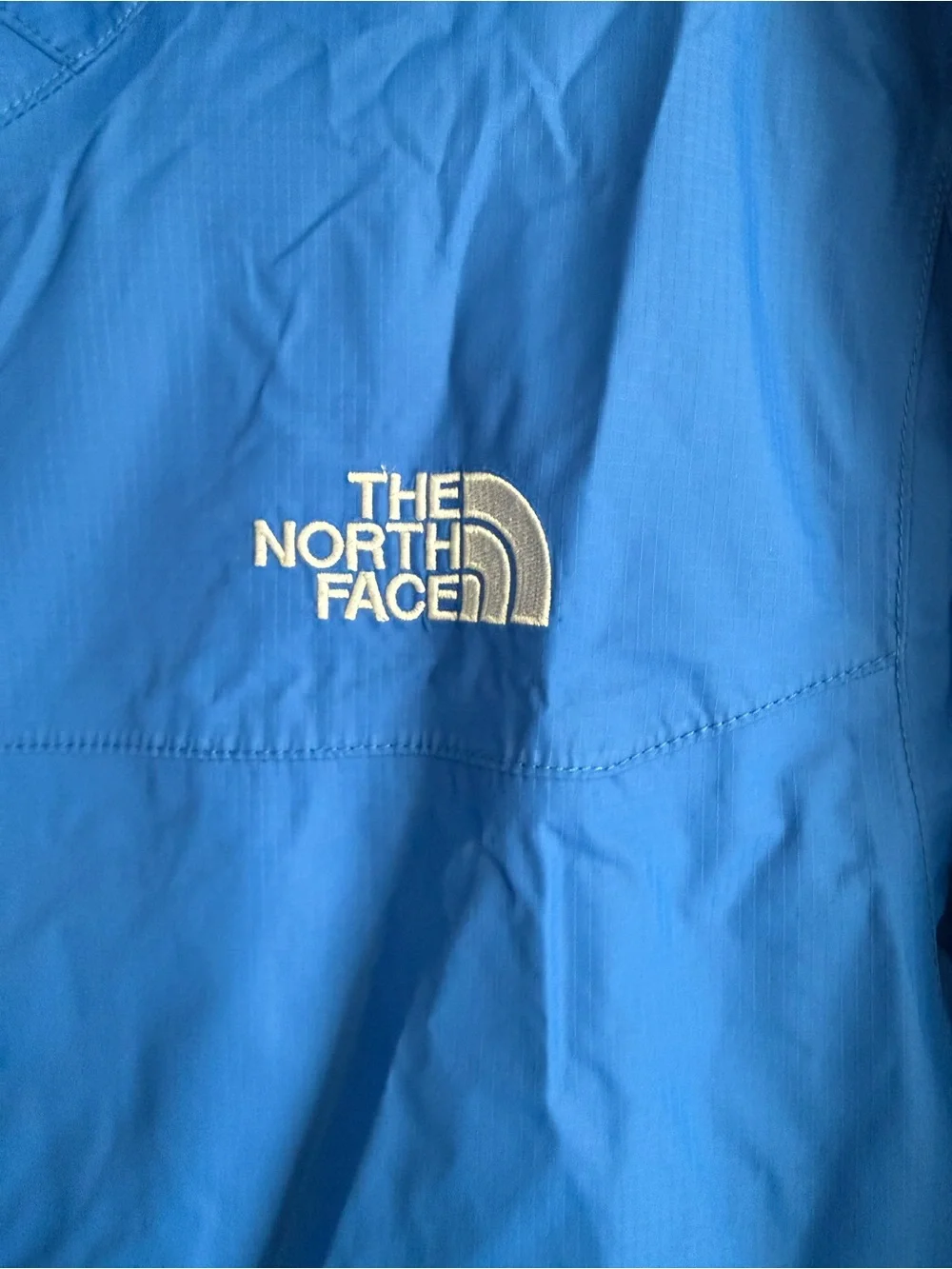 The North Face men’s blue raincoat/shell